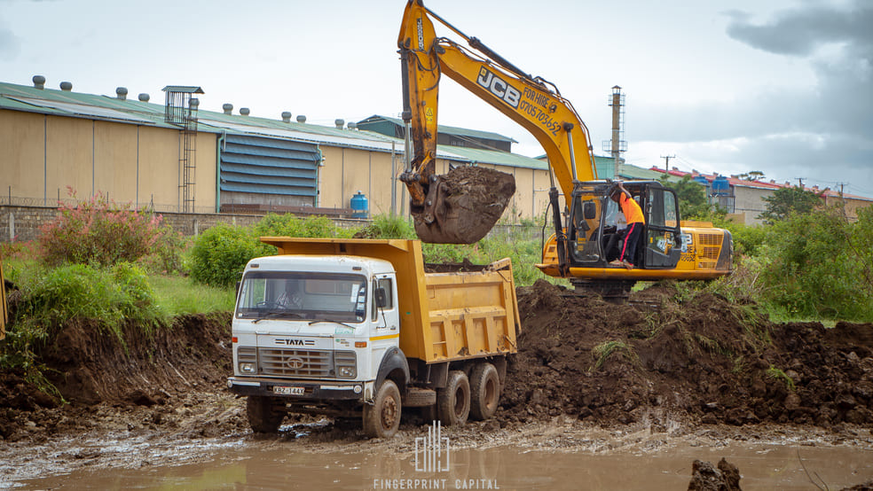 Excavator loading a tipper truck on site